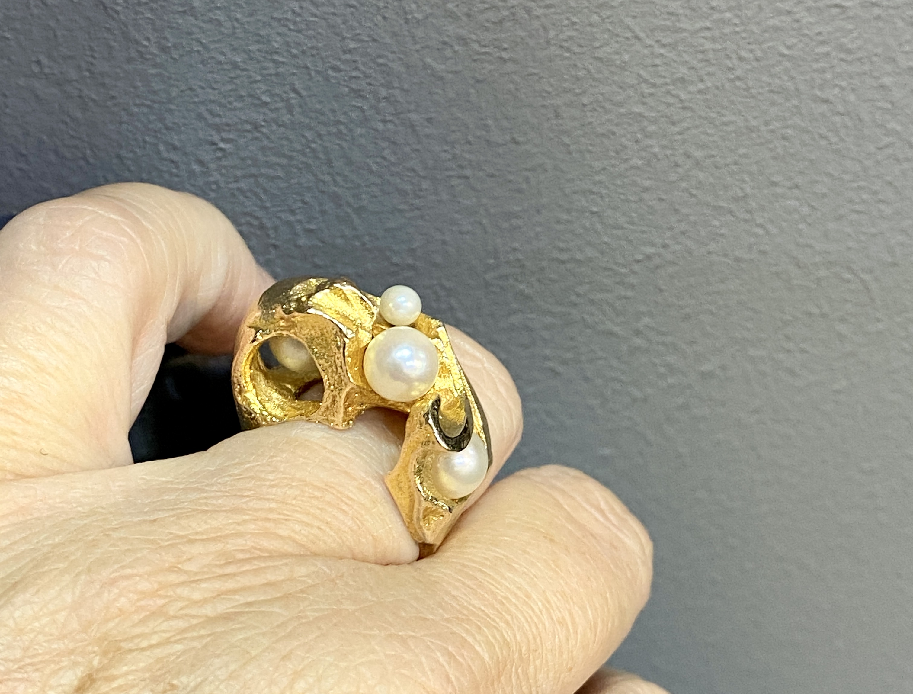 Discover the exquisite Gold & Pearl Ring Dew Drops designed by Bjorn Weckstrom. This stunning piece features a delicate design that blends elegance with timeless beauty, perfect for any occasion. Shop now and add a touch of luxury to your jewelry collection.